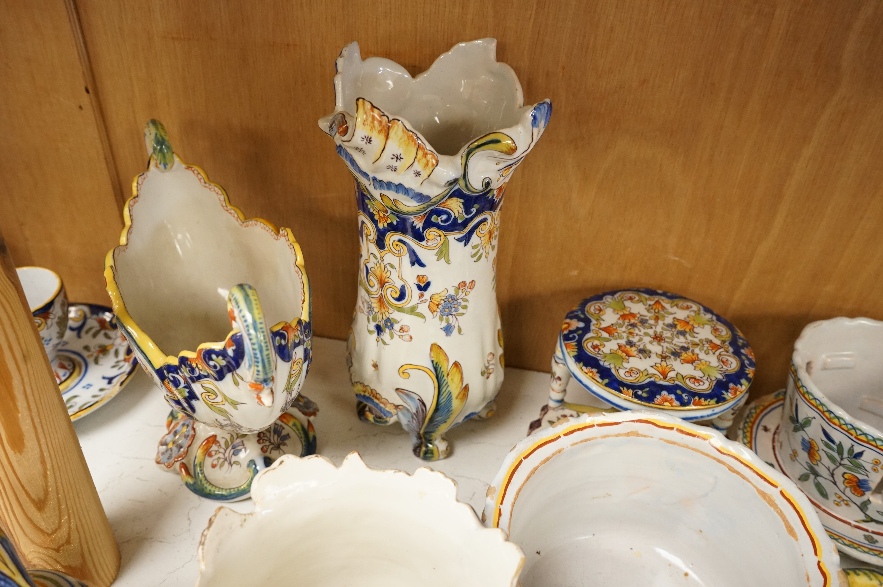 A group of French faience pottery to include trinket boxes, a teapot and vases, largest 32cm in length